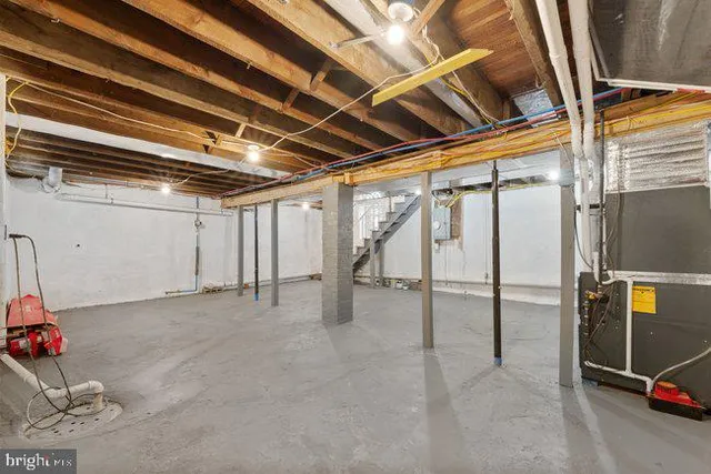 a bathroom with a granite countertop sink mirror and a bathtub