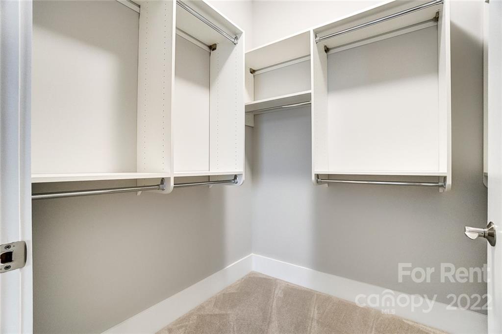 830 Providence Road, Unit 102 Charlotte, NC 28207 - Photo 25 of 31 a view of an empty walk in closet