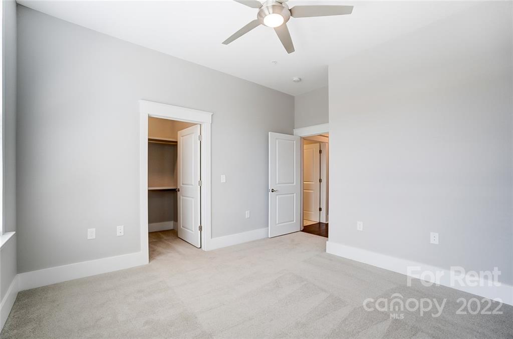 830 Providence Road, Unit 102 Charlotte, NC 28207 - Photo 27 of 31 a view of empty room with ceiling fan