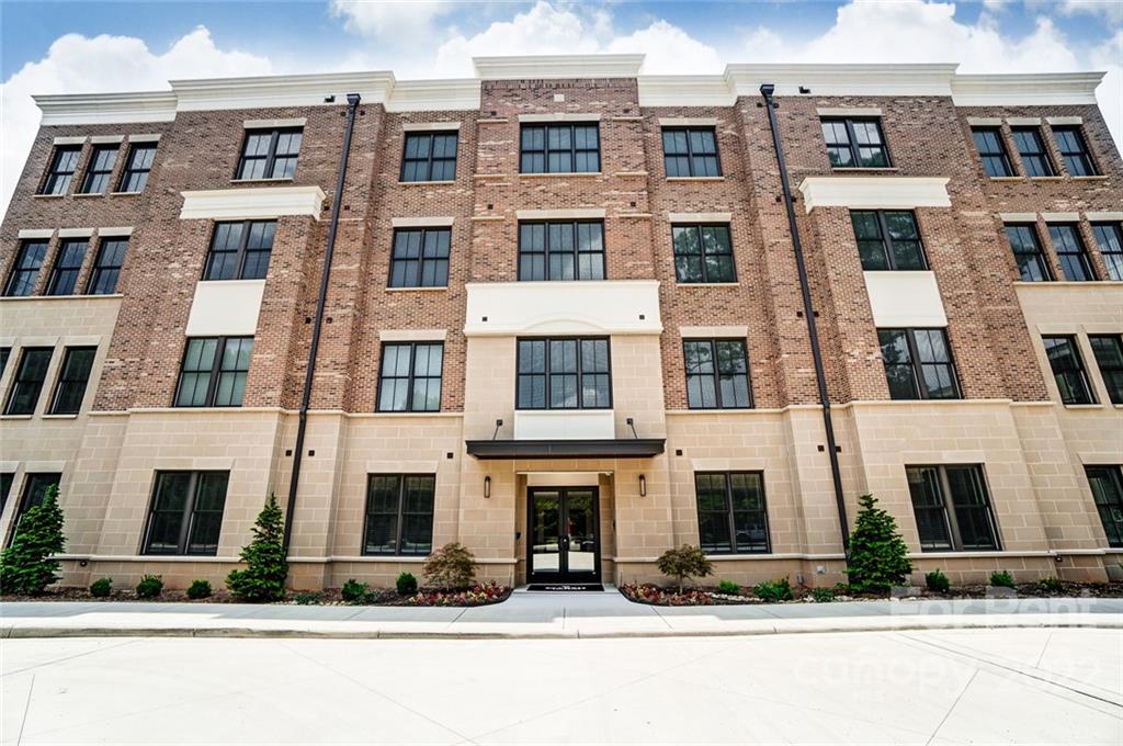 830 Providence Road, Unit 102 Charlotte, NC 28207 - Photo 3 of 31 a front view of multi story residential apartment building