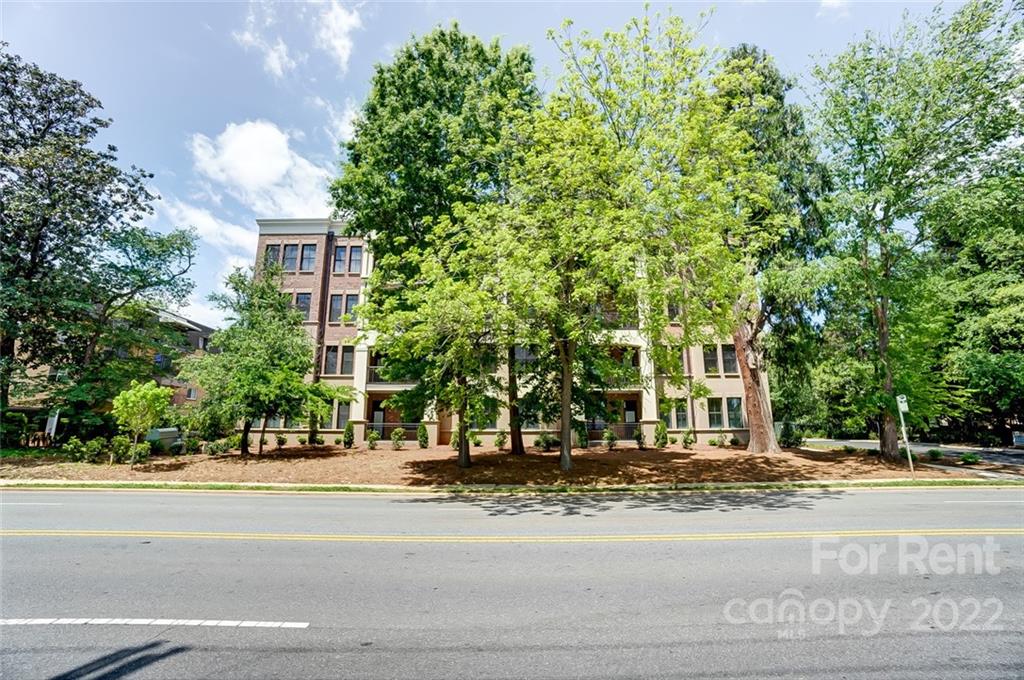 830 Providence Road, Unit 102 Charlotte, NC 28207 - Photo 5 of 31 a view of a building with a street