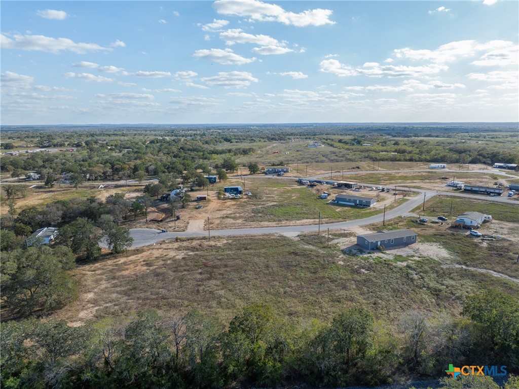 150 Azalea Ct Dale Dale, TX 78616 - Photo 3 of 11 a view of a town with big trees