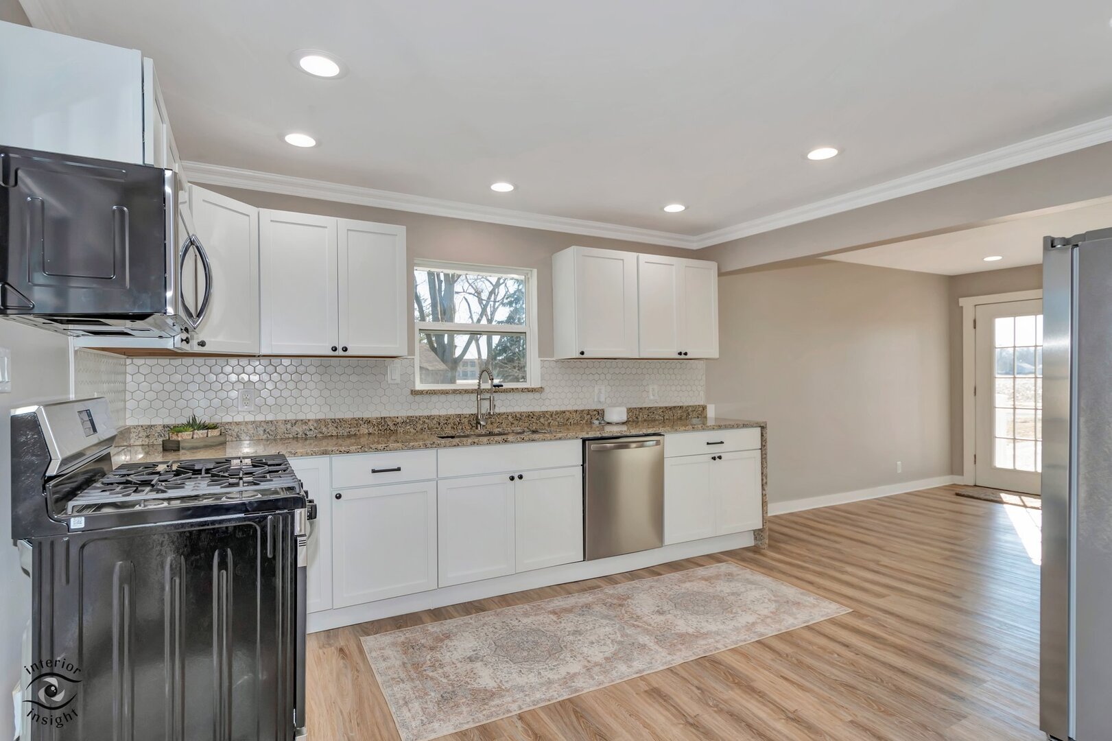 5101 East 1000 Road North Kankakee, IL 60901 - Photo 5 of 35 a kitchen with granite countertop a sink stove and cabinets
