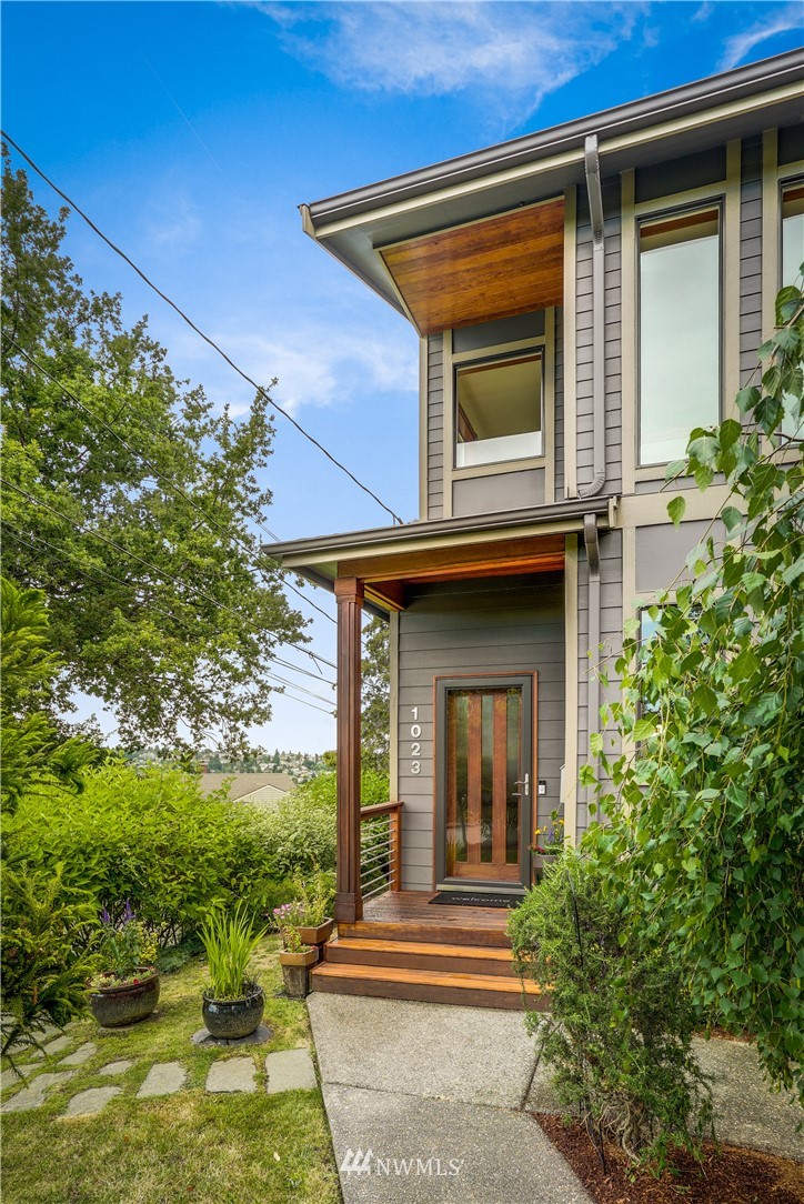 1023 West Ruffner Street Seattle, WA 98119 - Photo 2 of 25 a view of the house with a small yard
