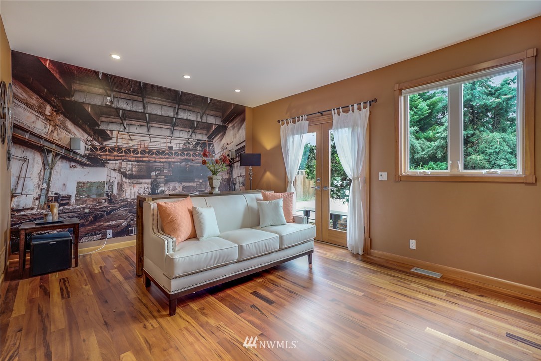1023 West Ruffner Street Seattle, WA 98119 - Photo 12 of 25 a living room with furniture and large windows