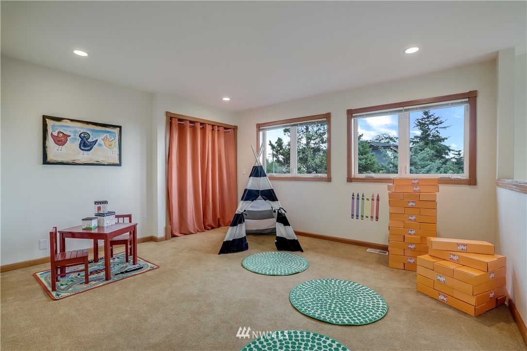 1023 West Ruffner Street Seattle, WA 98119 - Photo 15 of 25 a room with furniture and a window