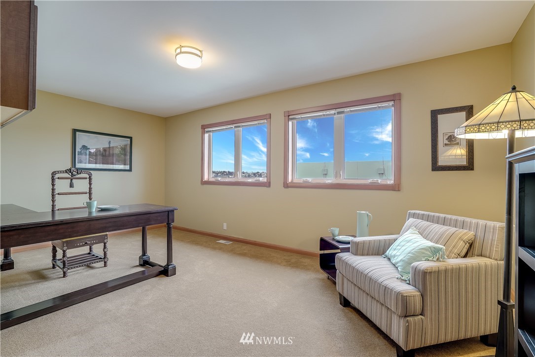 1023 West Ruffner Street Seattle, WA 98119 - Photo 19 of 25 a living room with furniture and a window