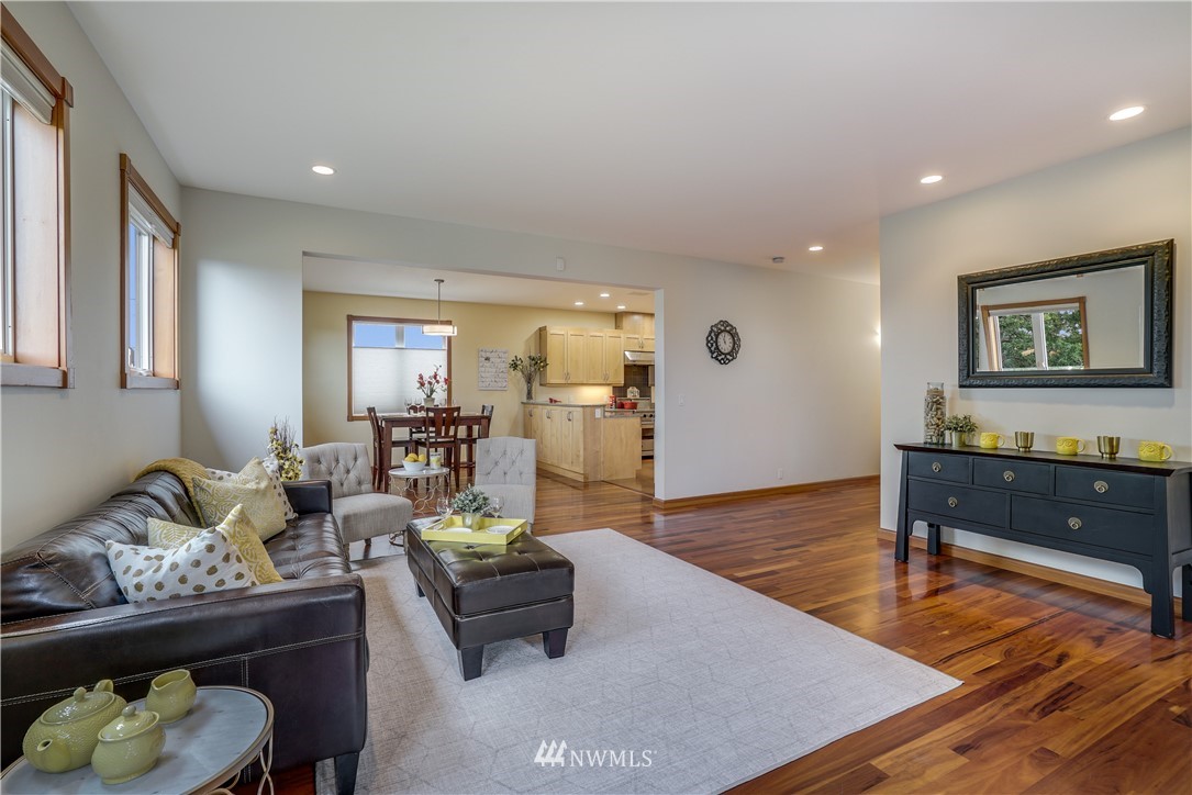 1023 West Ruffner Street Seattle, WA 98119 - Photo 3 of 25 a living room with furniture and a wooden floor
