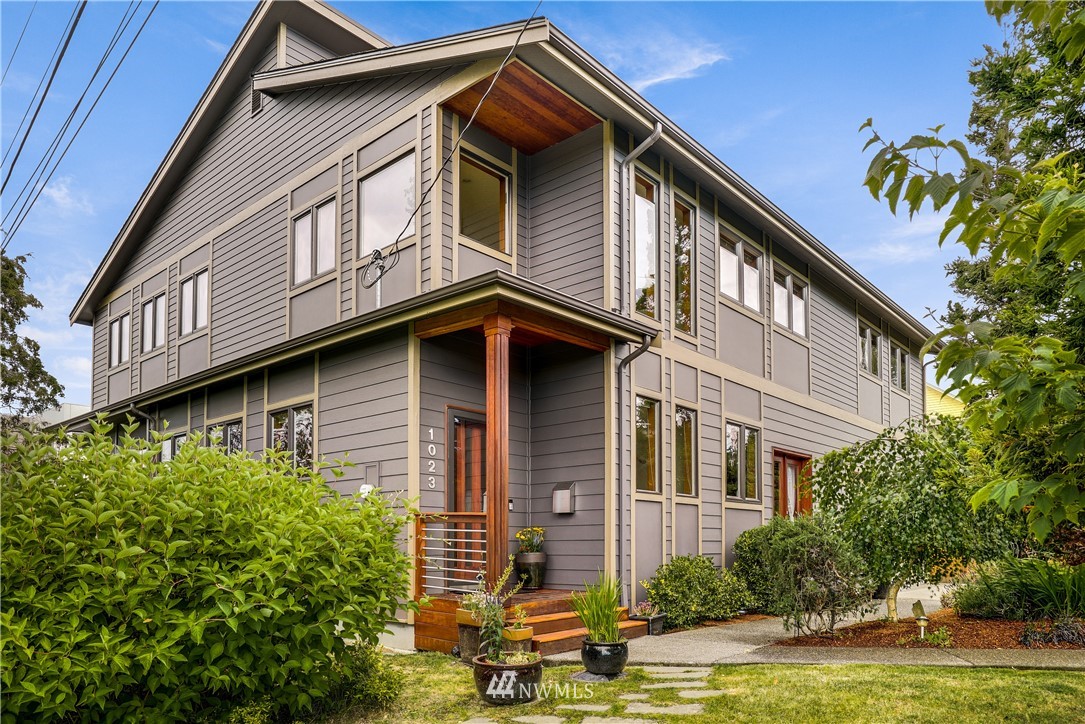 1023 West Ruffner Street Seattle, WA 98119 - Photo 25 of 25 a front view of a house with a yard