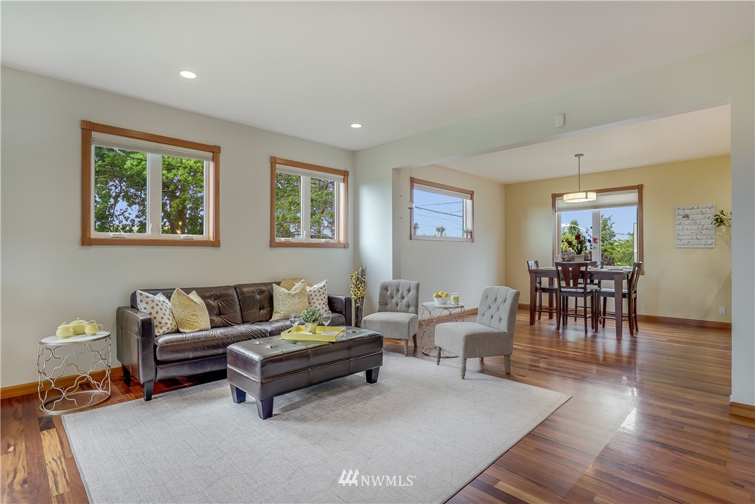 1023 West Ruffner Street Seattle, WA 98119 - Photo 4 of 25 a living room with furniture and a wooden floor