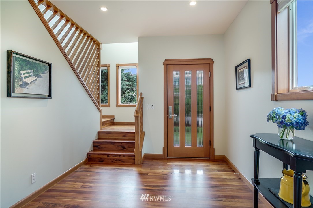1023 West Ruffner Street Seattle, WA 98119 - Photo 9 of 25 a view of entryway with wooden floor and stairs