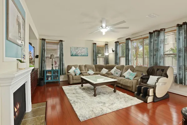 a living room with furniture and a fireplace