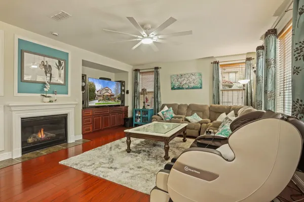 a living room with furniture and a fireplace