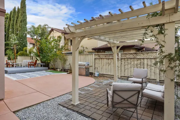 a view of a backyard with sitting area