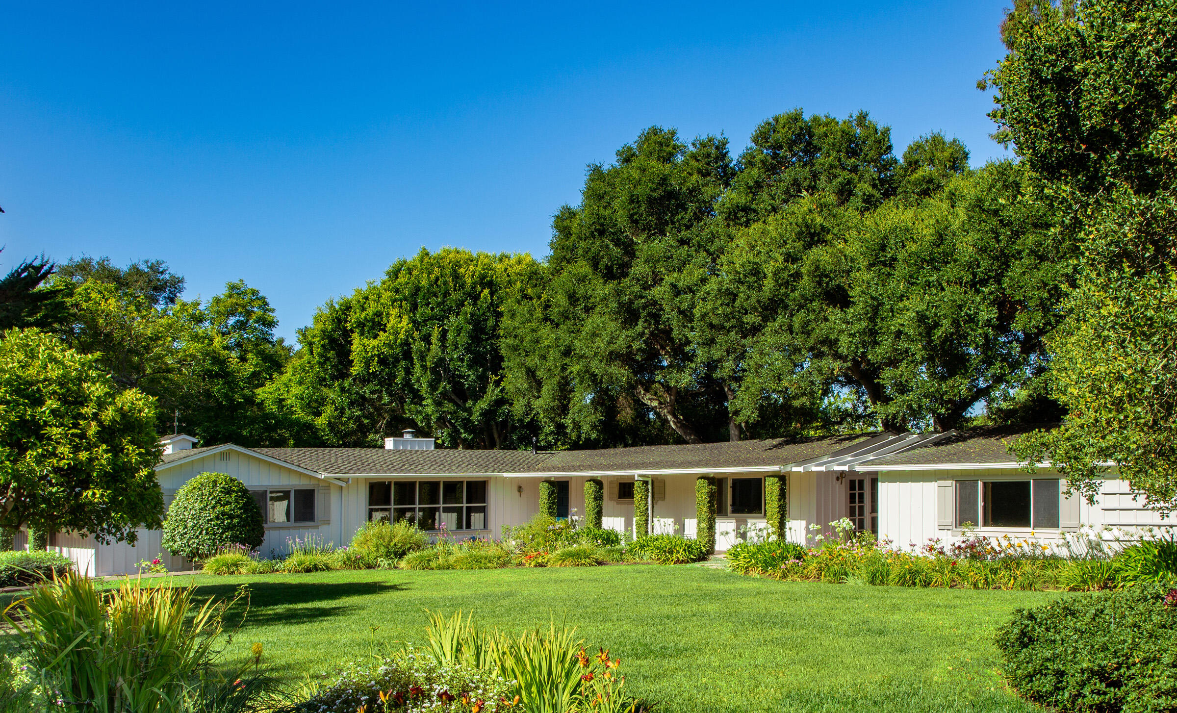 279 Santa Rosa Lane Montecito, CA 93108 - Photo 1 of 27 a front view of a house with garden
