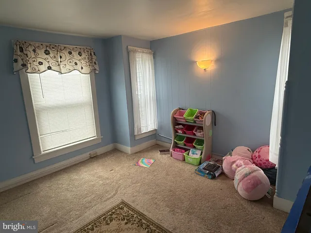 a room with toys and a wooden floor