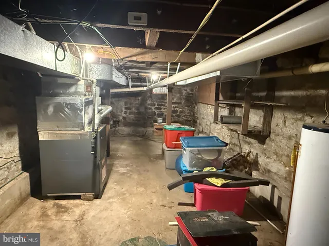 a backyard of a house with a table and chairs