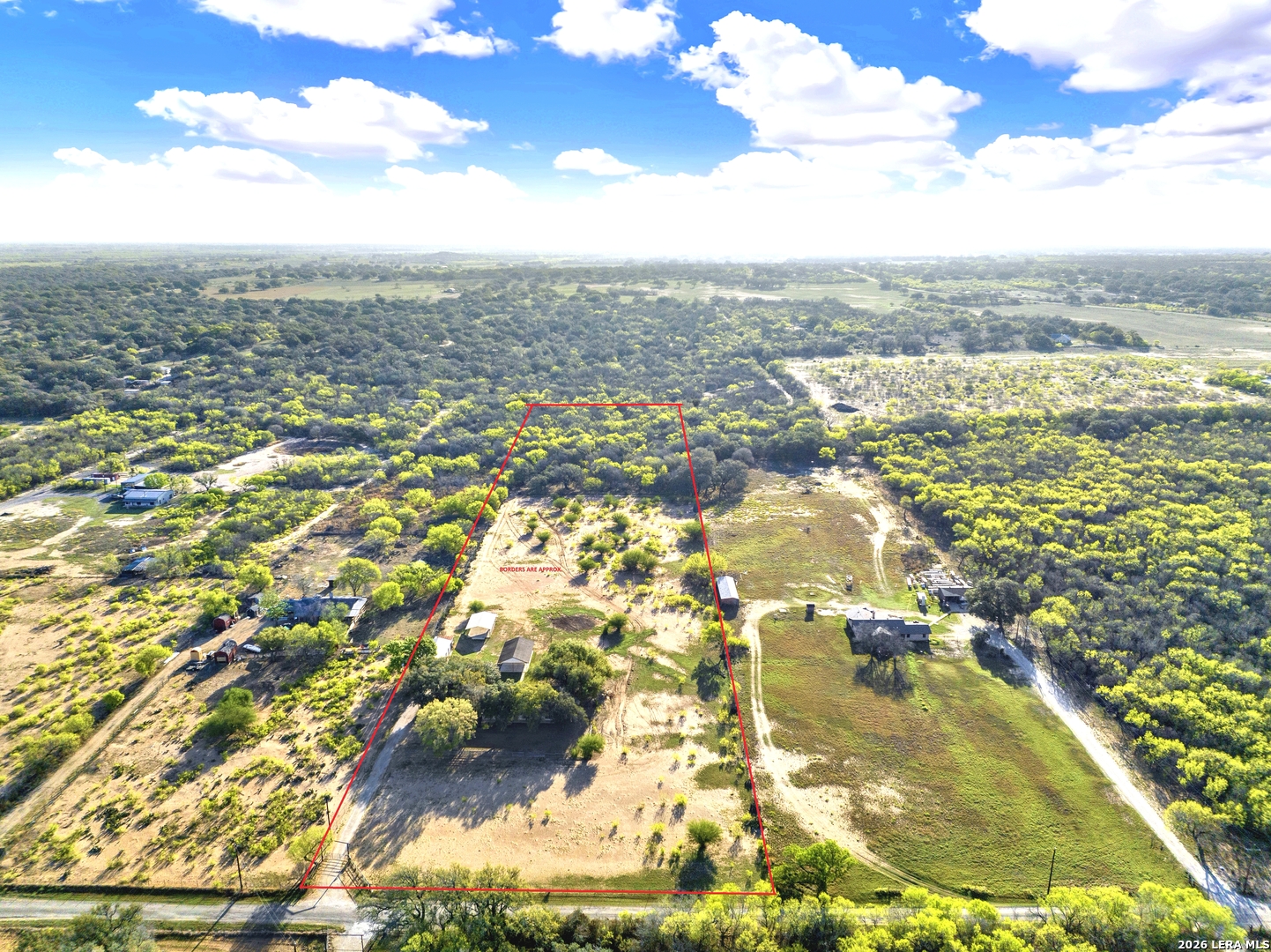 386 County Road 763 Devine, TX 78016 - Photo 1 of 49 an aerial view of residential houses with outdoor space
