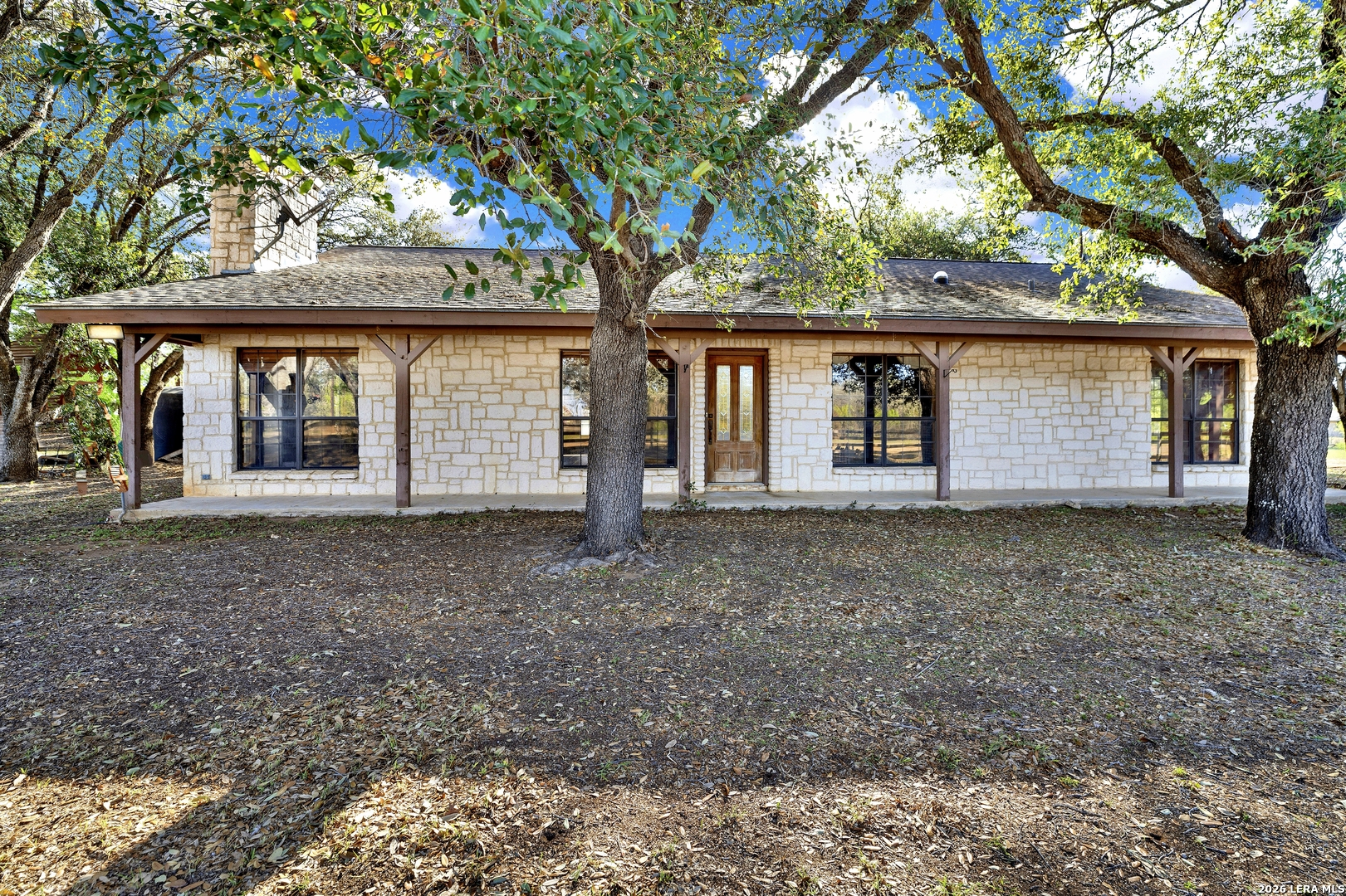 386 County Road 763 Devine, TX 78016 - Photo 11 of 49 front view of a house with a tree
