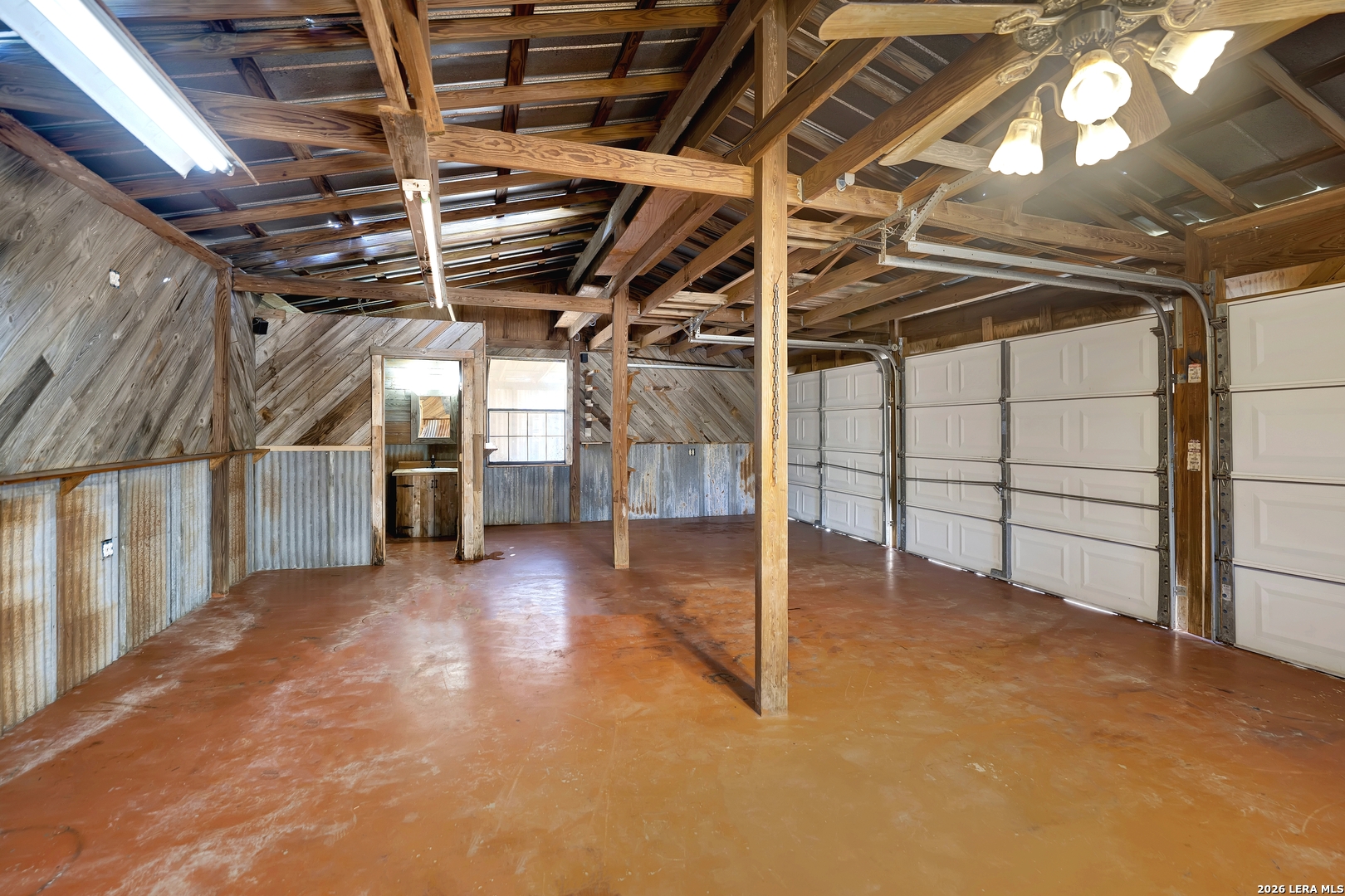 386 County Road 763 Devine, TX 78016 - Photo 15 of 49 a view of a room with wooden walls