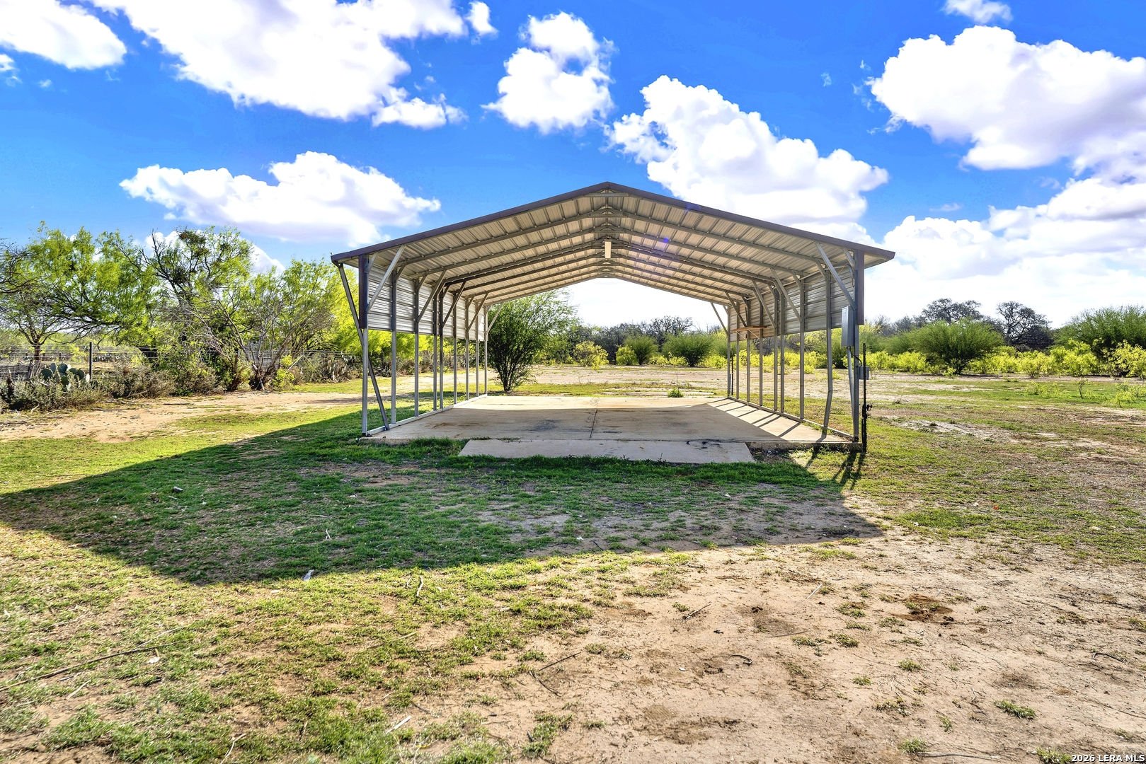 386 County Road 763 Devine, TX 78016 - Photo 18 of 49 a view of a house with backyard and sitting area