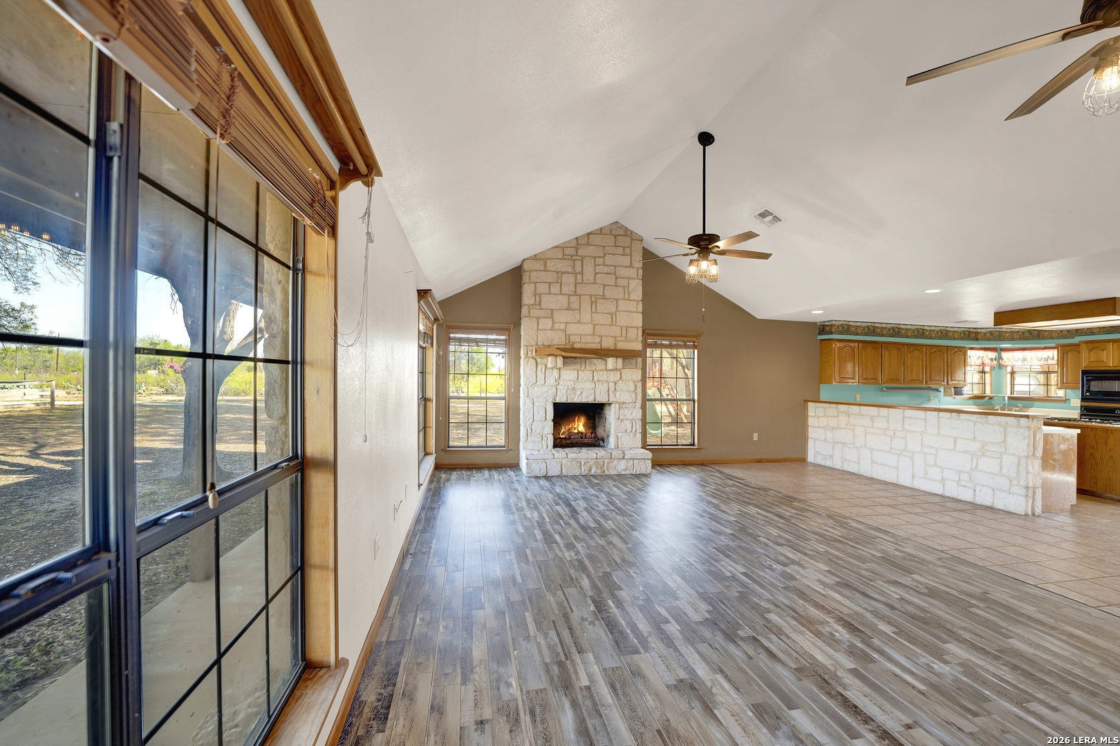 386 County Road 763 Devine, TX 78016 - Photo 23 of 49 a view of empty room with wooden floor and fireplace