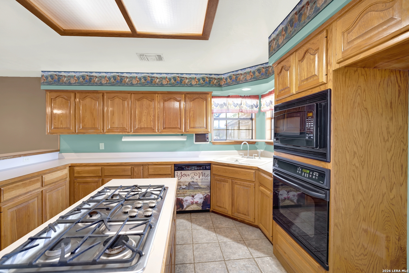 386 County Road 763 Devine, TX 78016 - Photo 29 of 49 a kitchen with stainless steel appliances a stove and a refrigerator
