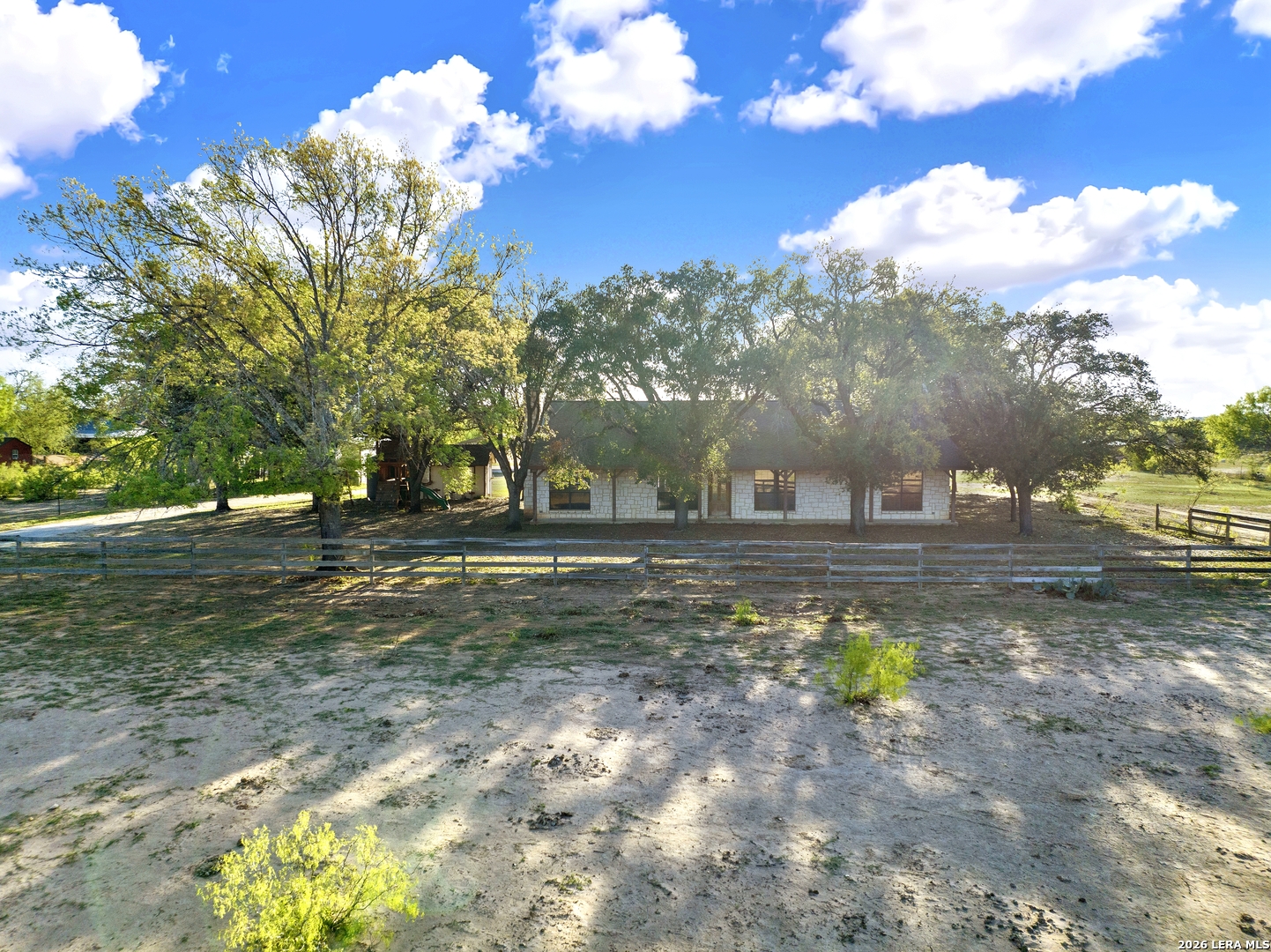 386 County Road 763 Devine, TX 78016 - Photo 3 of 49 a front view of a house with a yard