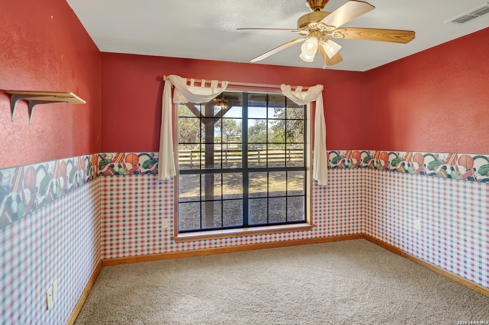 386 County Road 763 Devine, TX 78016 - Photo 36 of 49 a view of an empty room with a window