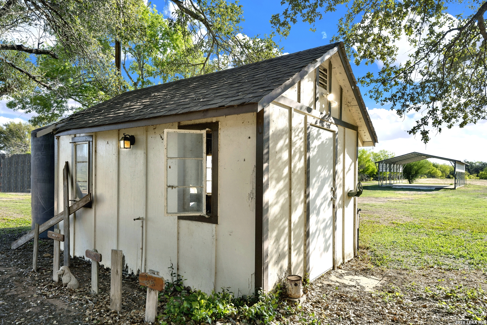 386 County Road 763 Devine, TX 78016 - Photo 40 of 49 a view of a house with a yard