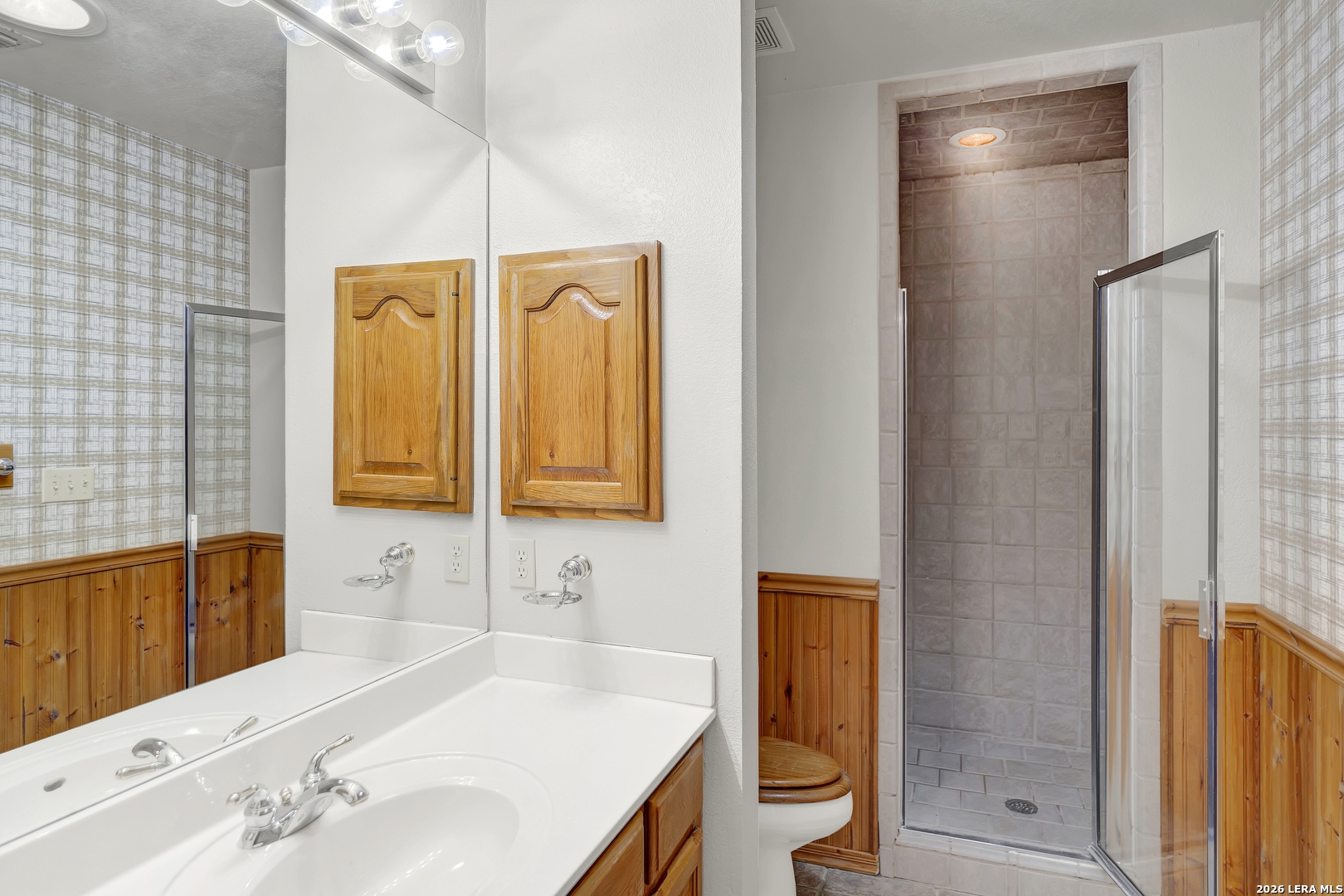386 County Road 763 Devine, TX 78016 - Photo 41 of 49 a bathroom with a sink and a mirror