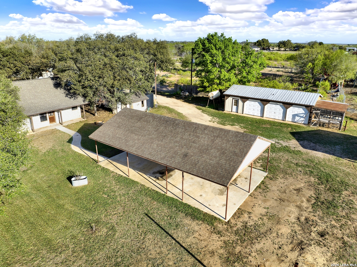 386 County Road 763 Devine, TX 78016 - Photo 7 of 49 an aerial view of a house with a yard