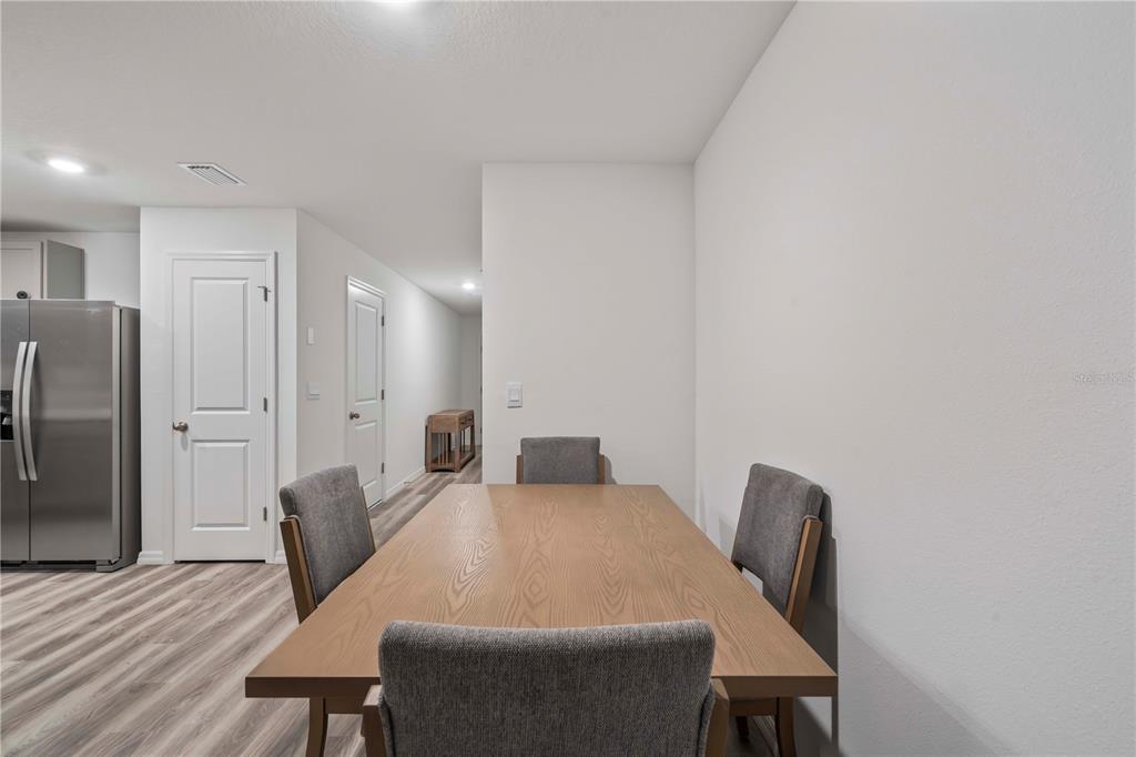 959 Spotted Egret Loop Ruskin, FL 33570 - Photo 12 of 36 a view of a dining room with furniture