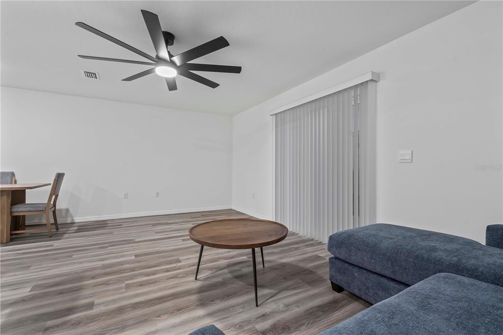 959 Spotted Egret Loop Ruskin, FL 33570 - Photo 16 of 36 a living room with furniture and a wooden floor