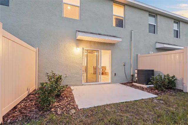 a bedroom with a bed and a potted plant
