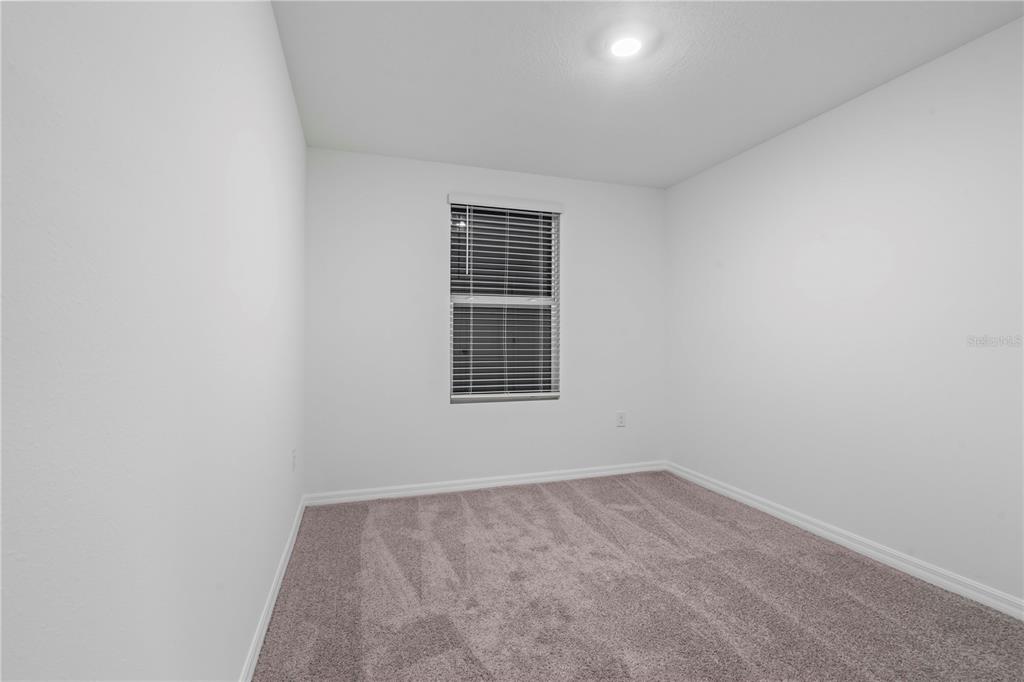 959 Spotted Egret Loop Ruskin, FL 33570 - Photo 31 of 36 an empty room with a window