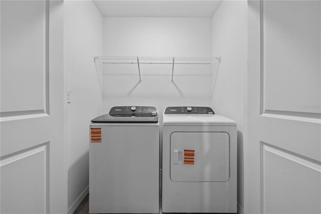 959 Spotted Egret Loop Ruskin, FL 33570 - Photo 36 of 36 a utility room with dryer and washer