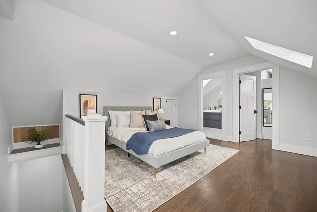 a bedroom with a bed and a couch