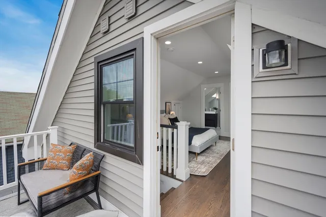 a view of a porch with furniture and a window