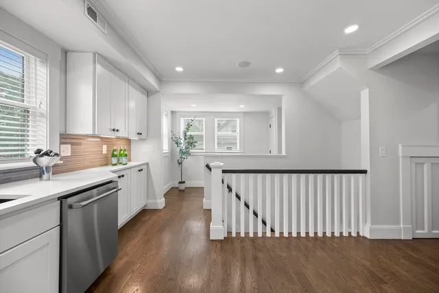 a kitchen with sink and cabinets