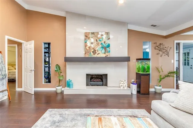 a kitchen with stainless steel appliances a refrigerator and wooden floor