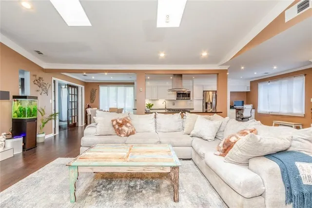 a living room with fireplace furniture and a flat screen tv