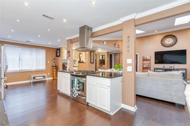 a bedroom with bed and a book shelf