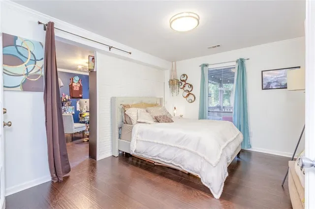 a bathroom with a double vanity sink toilet and shower