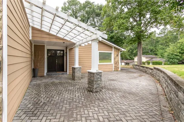 a living room with furniture wooden floor and a fireplace