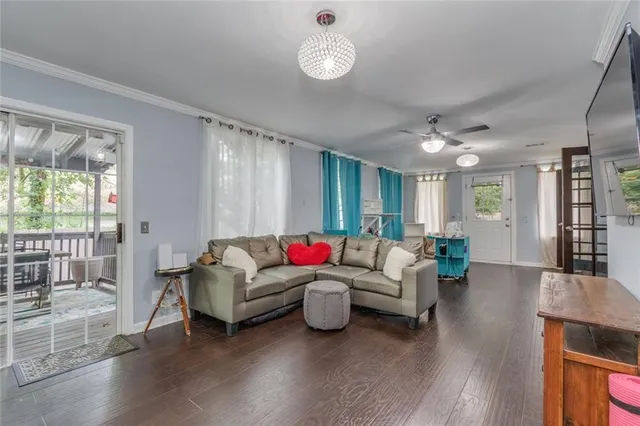 a view of a chairs in patio with wooden fence