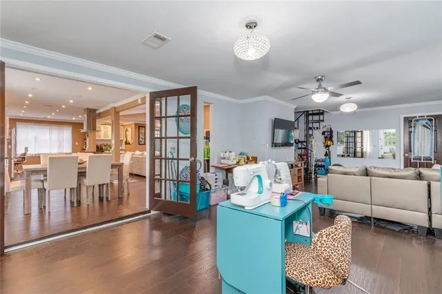 a view of a chair and table in backyard of the house