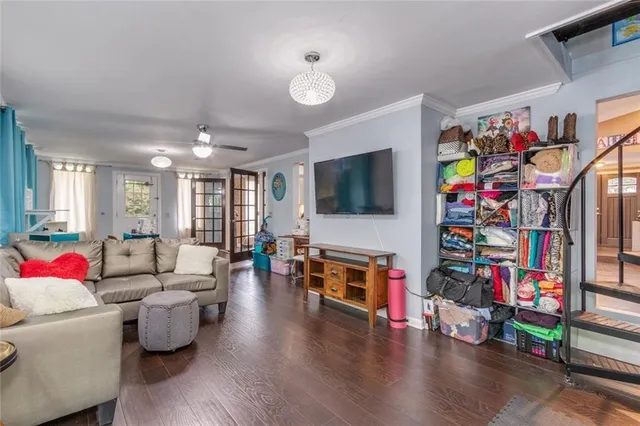 a view of a chair and table in backyard of the house