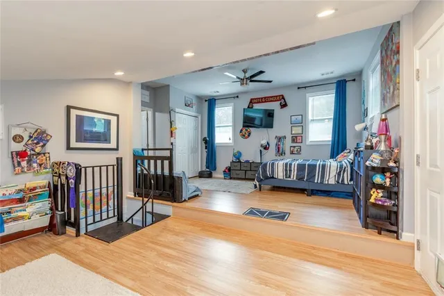 a view of a dining room with wooden floor and furniture