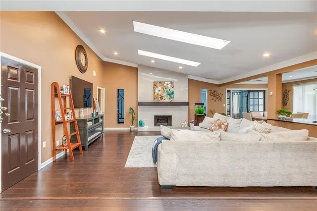 a living room with fireplace furniture and a fireplace
